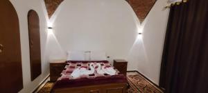 Postel nebo postele na pokoji v ubytování Luxor Villa Hatshepsut