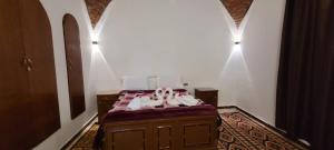 Postel nebo postele na pokoji v ubytování Luxor Villa Hatshepsut