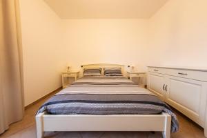 Postel nebo postele na pokoji v ubytování Antico Borgo Perrotta