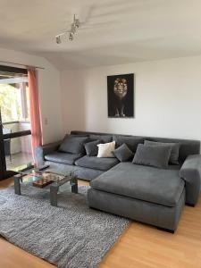 a living room with a couch and a table at City View in Bodenwerder