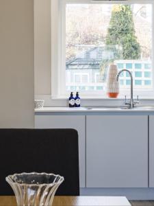 a kitchen with a sink and a window at 1 North Street, Elie in Elie +43 photos