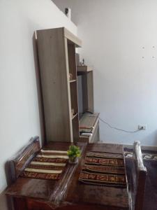 an empty room with a table and a cabinet at mi Habitat in Asunción