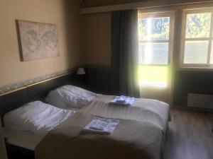 Ένα ή περισσότερα κρεβάτια σε δωμάτιο στο Setesdal Motel & Apartments