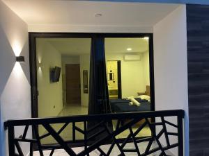 a bedroom with a mirror and a bed in a room at Alce33 in Cancún