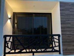 a balcony in a house with a window at Alce33 in Cancún