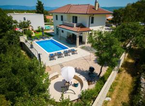 an aerial view of a house with a swimming pool at Villa Andante in Krk