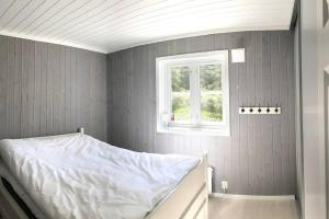 Uma cama ou camas num quarto em Modern cottage at Nordseter/Sjusjøen/Lillehammer