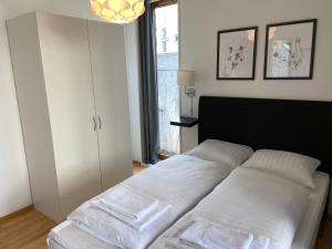 Postel nebo postele na pokoji v ubytování South Harbour Apartments