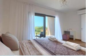 En eller flere senge i et værelse på Villa Esmeralda II by SeeAdria Agency + 39 billeder