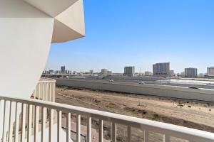 a view of a city from a balcony at Silkhaus Chic Luxury Studio Opposite Silicon Oasis Shopping Mall in Dubai
