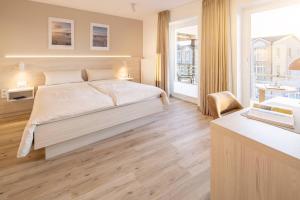 Voodi või voodid majutusasutuse Hotel Stranddistel toas