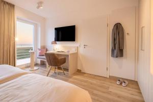 Voodi või voodid majutusasutuse Hotel Stranddistel toas