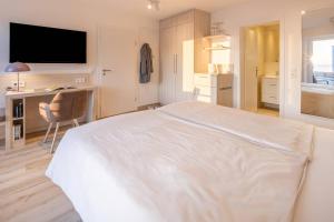 Voodi või voodid majutusasutuse Hotel Stranddistel toas