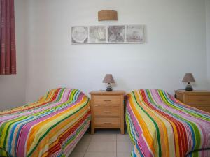 Posteľ alebo postele v izbe v ubytovaní gite location climatisé avec Piscine en Ardèche