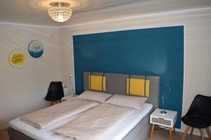 En eller flere senge i et værelse på Ferienwohnung auf dem Dorf, Külsheim