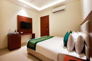 Voodi või voodid majutusasutuse Hotel Z Suites with One Way Airport Shuttle toas
