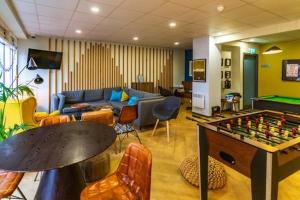 a living room with a couch and a pool table at Modern Stylish Ensuite at Student Roost Buchanan View in Glasgow for Students Only in Glasgow