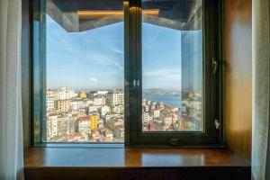 a window with a view of a city at Marble Hotel in Istanbul