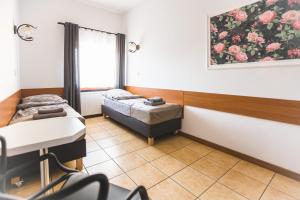 a hospital room with two beds and a window at Pokoje gościnne LECH in Gubin