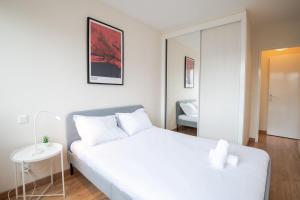 Posteľ alebo postele v izbe v ubytovaní Le Globe Trotter - Tours