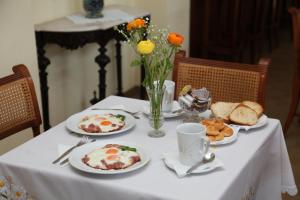 a table with plates of food and bread on it at Maistrali in Galissas