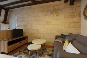 a living room with a couch and a table at Lovely T2 in the heart of Tours in Tours