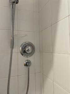 a shower with a shower head in a bathroom at Airport house , Speke in Speke