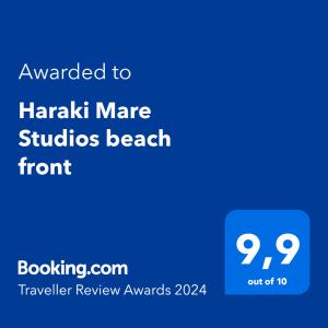 Ett certifikat, pris eller annat dokument som visas upp på Haraki Mare Studios beach front