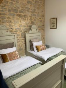 Postel nebo postele na pokoji v ubytování Maison Le Haut Fée