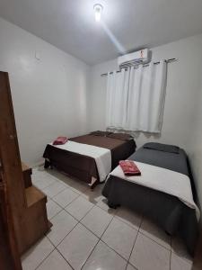 מיטה או מיטות בחדר ב-Casa a 2km da praia do Aracagy
