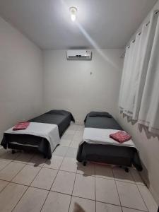 מיטה או מיטות בחדר ב-Casa a 2km da praia do Aracagy