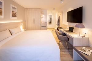 Voodi või voodid majutusasutuse Hotel Stranddistel toas