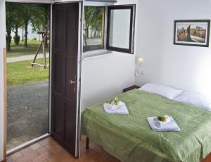 Posteľ alebo postele v izbe v ubytovaní Resort Beach Nová Živohošť