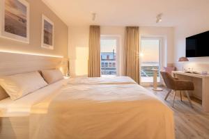 Voodi või voodid majutusasutuse Hotel Stranddistel toas