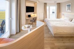 Voodi või voodid majutusasutuse Hotel Stranddistel toas