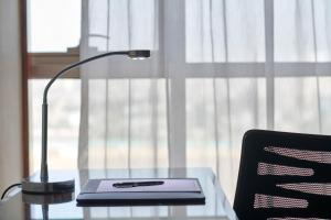 a desk with a lamp and a laptop on a table at Intercontinental Cairo Citystars, an IHG Hotel in Cairo