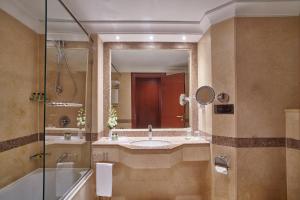 a bathroom with a sink and a shower and a mirror at Intercontinental Cairo Citystars, an IHG Hotel in Cairo