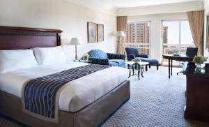 a hotel room with a bed and a living room at Intercontinental Cairo Citystars by IHG in Cairo +193 photos