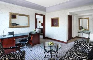 a living room with a couch and a table at Intercontinental Cairo Citystars by IHG in Cairo