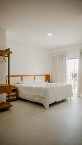 Ένα ή περισσότερα κρεβάτια σε δωμάτιο στο Casa reserva boa vista