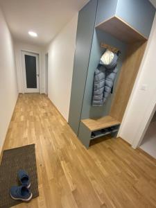 a room with a hallway with a closet at Apartman s terasou, v novostavbe in Prague