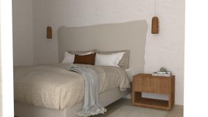 - une chambre avec un lit et une table de nuit en bois dans l'établissement El Refugi de Girona, à Gérone