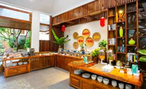 a restaurant with a counter in a room at Nadine Phu Quoc Resort & Spa in Phú Quốc