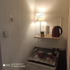 a lamp sitting on top of a stove in a room at VerdAqua in Moncarapacho +11 photos