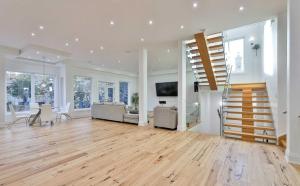 a large living room with a staircase and a living room at Executive Room in Toronto next to Yorkdale shopping centre in Toronto