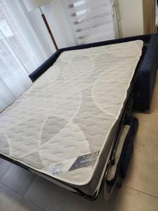 a mattress sitting on the floor in a room at Appartement Plein Centre in Saint-Brevin-les-Pins