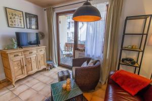 Μια τηλεόραση ή/και κέντρο ψυχαγωγίας στο Bed & Breakfast Sandra Müller
