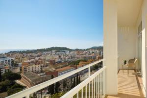 a balcony with a view of a city at Meliá Lloret de Mar in Lloret de Mar