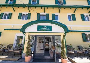 a building with a sign on the front of it at Landhaus Gretl by S4Y in Krumpendorf am Wörthersee