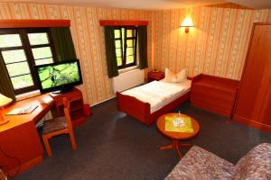 Tempat tidur dalam kamar di Hotel Wenzels Hof